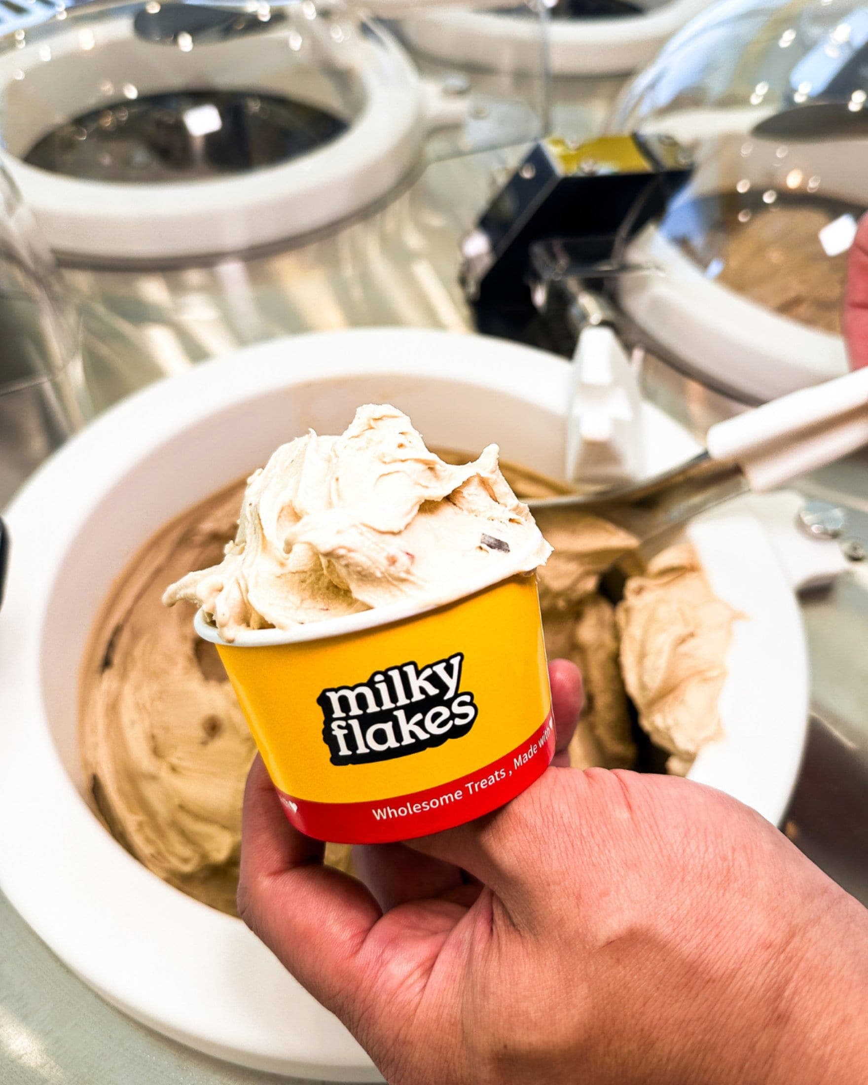 A cup of soft scoops lifted from the churner it was made in.