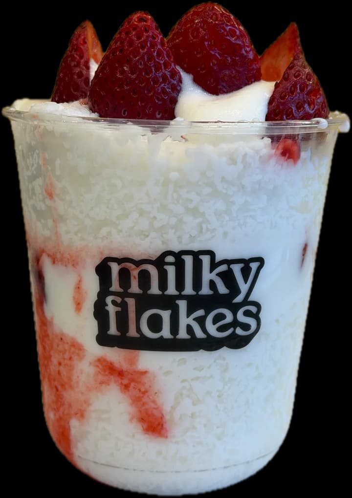 A cup of strawberry Milky Flakes on the counter.
